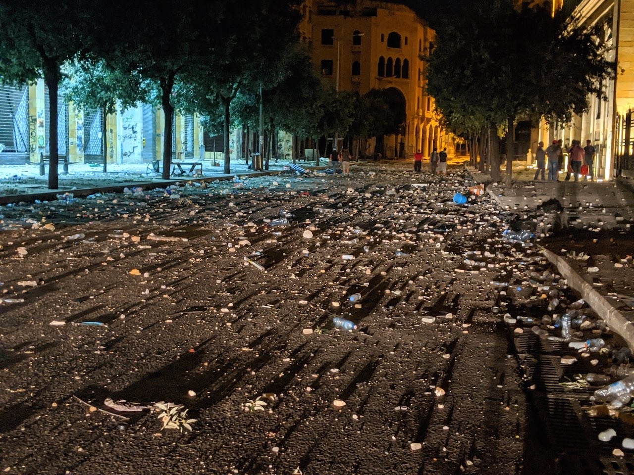 Downtown Beirut littered with tear gas canisters, rubber bullets, and debris following clashes.