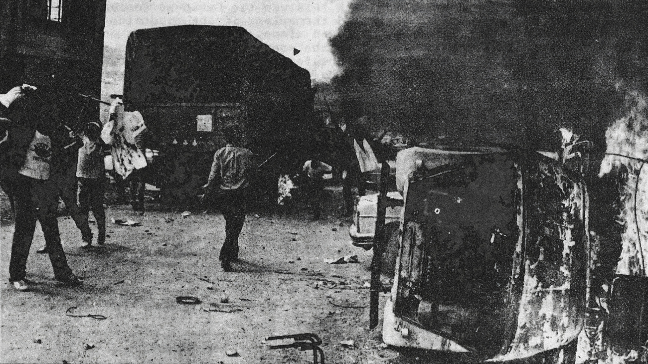 An Israeli military vehicle burns on the side of the road