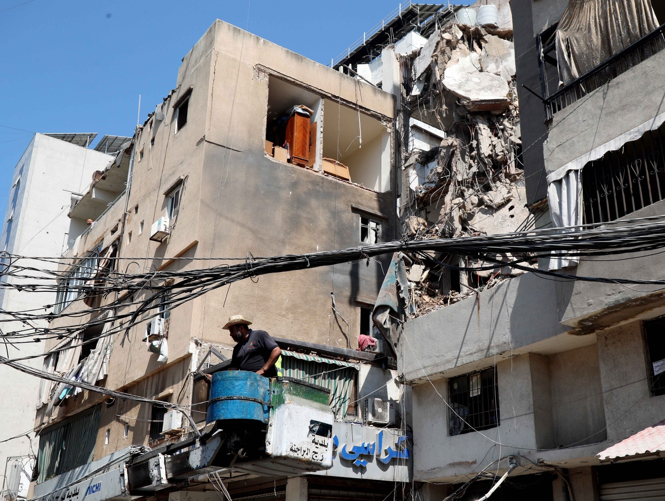 Repairs underway next to blast-damaged building