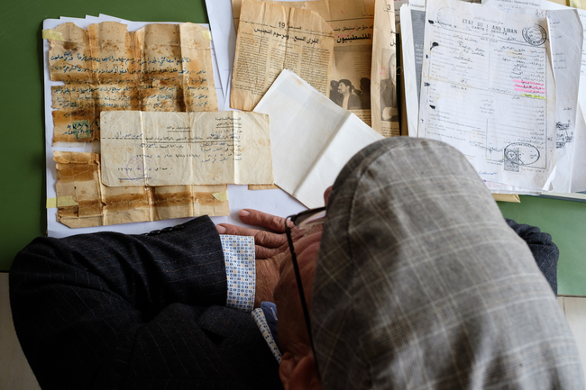 Man looks at family documents