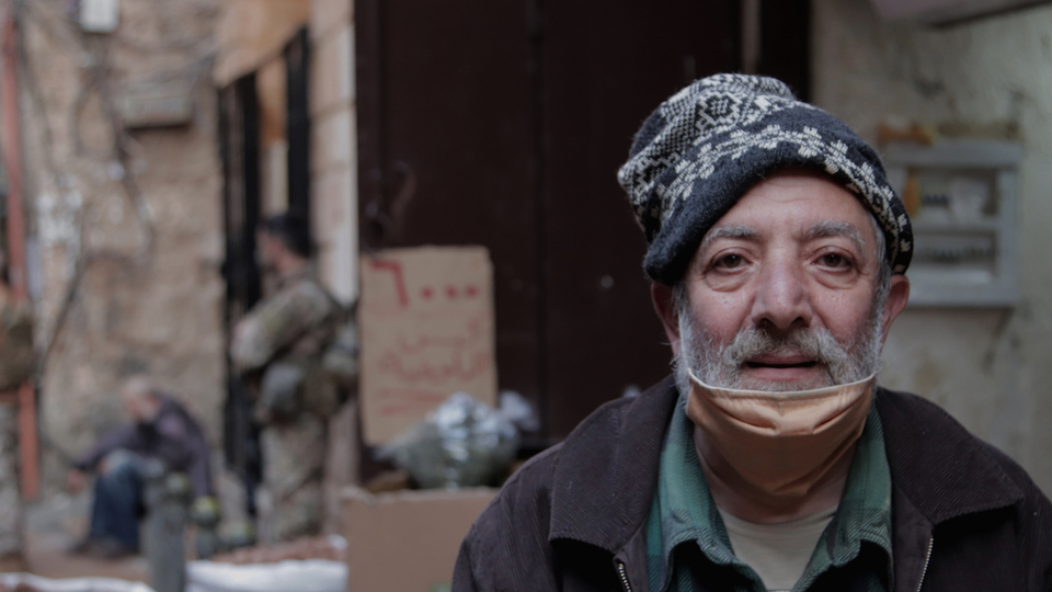 An elderly perfumer gets ready to close his shop in al-Rifa'iyah market ahead of curfew. Tripoli, Lebanon. November 22, 2020. (Fátima Fouad/The Public Source)