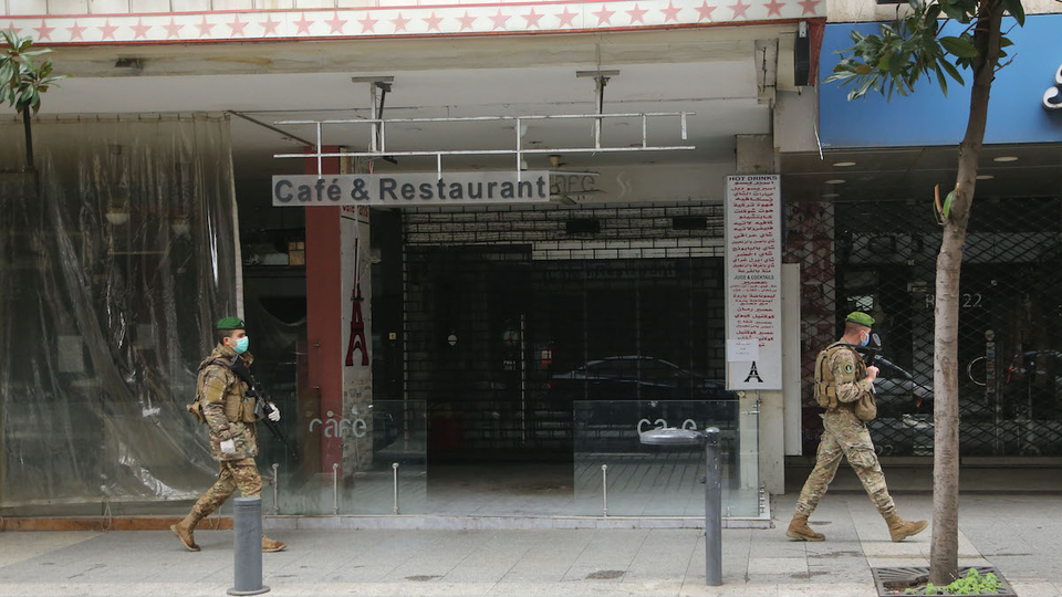 Lebanese army soldiers patrol Hamra Street during the state of general mobilization. Beirut, Lebanon. March 20, 2020. (Hussein Baydoun/The Public Source)